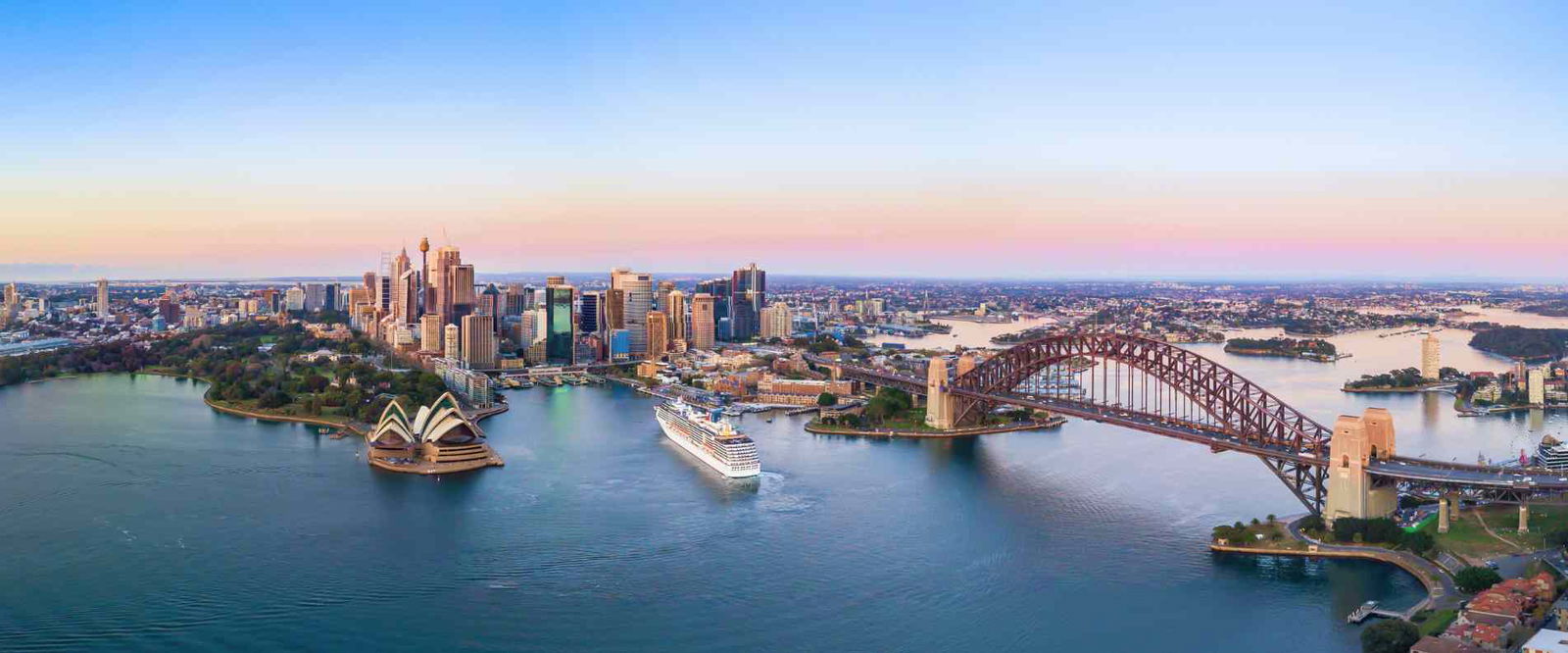 A skyline image depicting the city of Sydney and the sydney Harbour