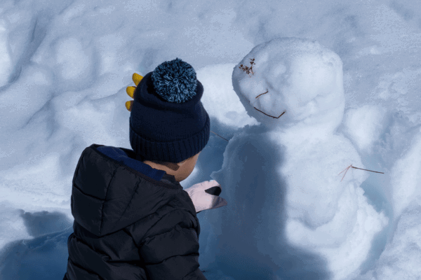 kid making a snowman